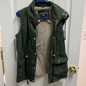 Size medium hooded green vest with soft/warm fuzzy inside.